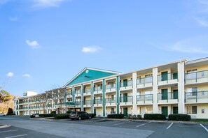 Guests can enjoy stunning views from the balconies of this multi-story motel.
