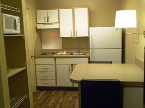 Full-sized fridge, microwave, stovetop, coffee/tea maker