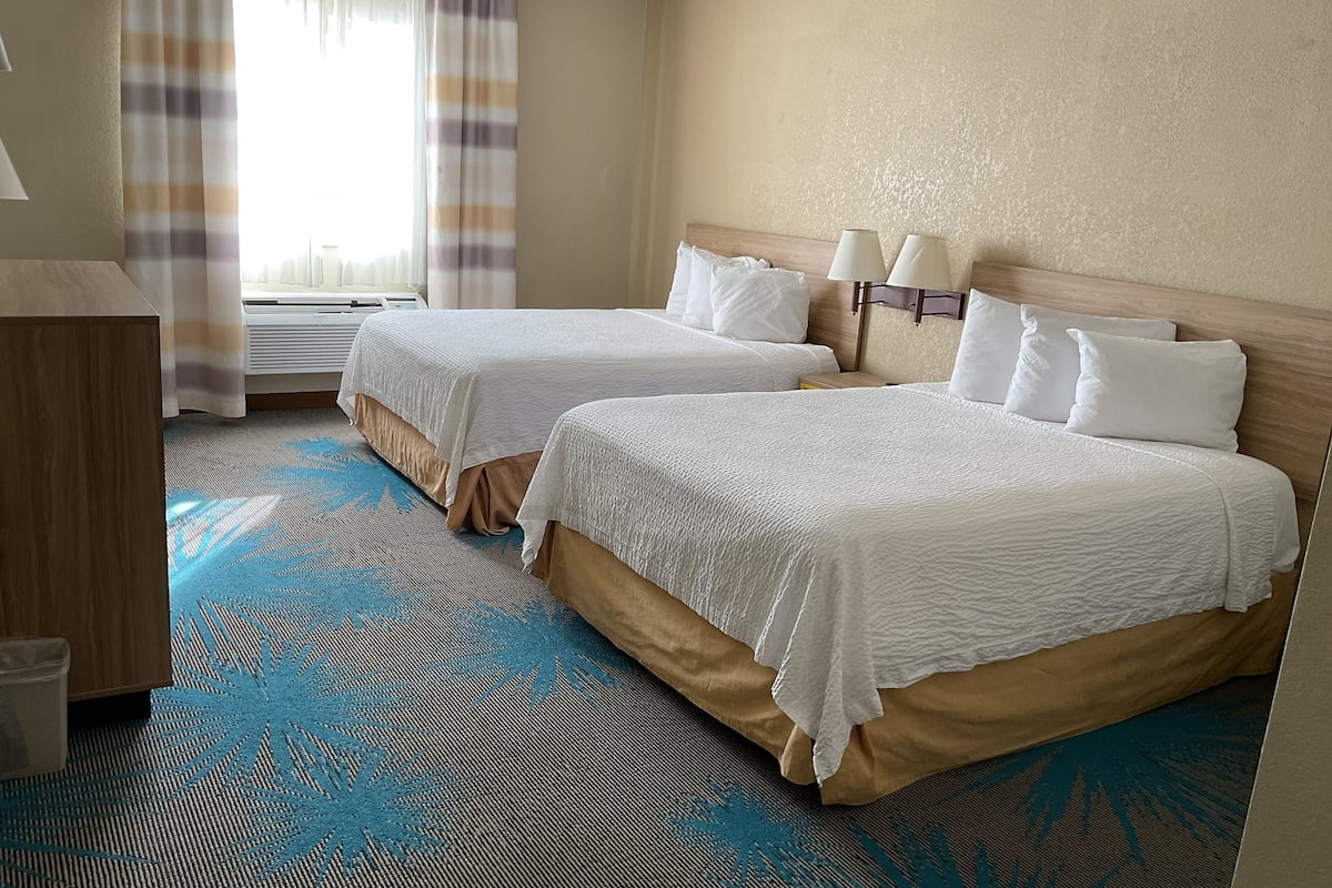 standard room, 2 queen beds | blackout curtains, cots/infant beds, rollaway beds, free wifi