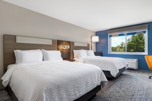 Ropa de cama hipoalergénica y tabla de planchar con plancha