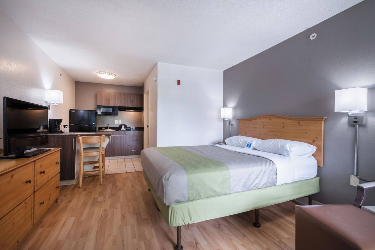 Premium bedding, desk, laptop workspace, iron/ironing board