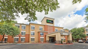 A hotel with a sign reading "extended stay america" and a lobby entrance.