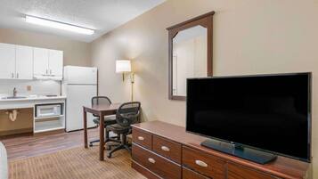 Desk, laptop workspace, blackout curtains, iron/ironing board