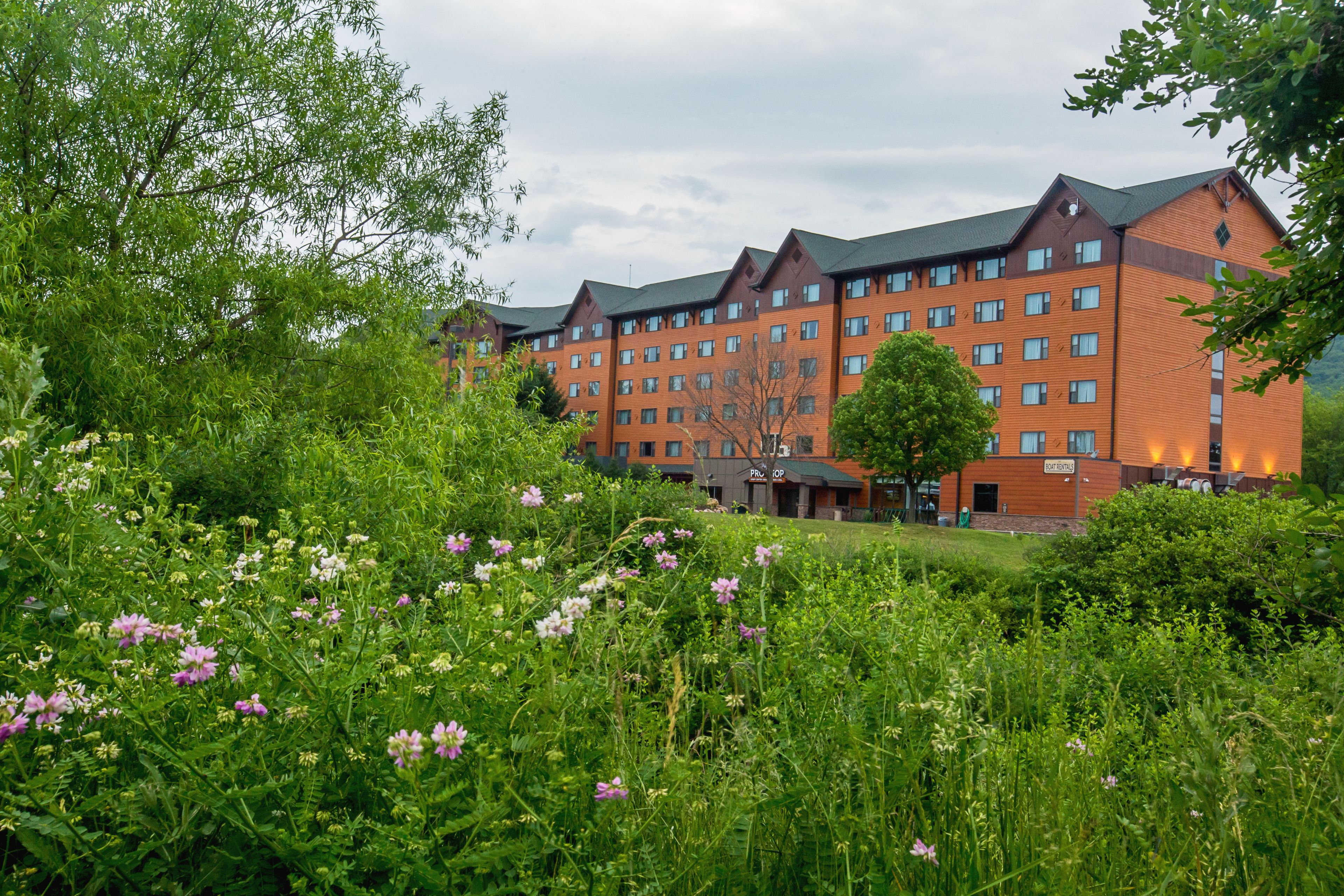 A multi-story hotel with a brick facade and multiple windows.