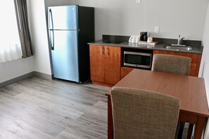 Suite, 1 Queen Bed, Non Smoking | In-room dining - Quality Inn & Suites Watertown Fort Drum (Calcium)
