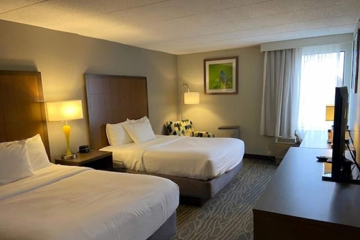 Premium bedding, desk, blackout drapes, soundproofing