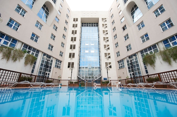 Seasonal outdoor pool, pool loungers