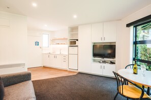 Classic Room, 1 Bedroom | Living area | 32-inch TV with satellite channels, DVD player
