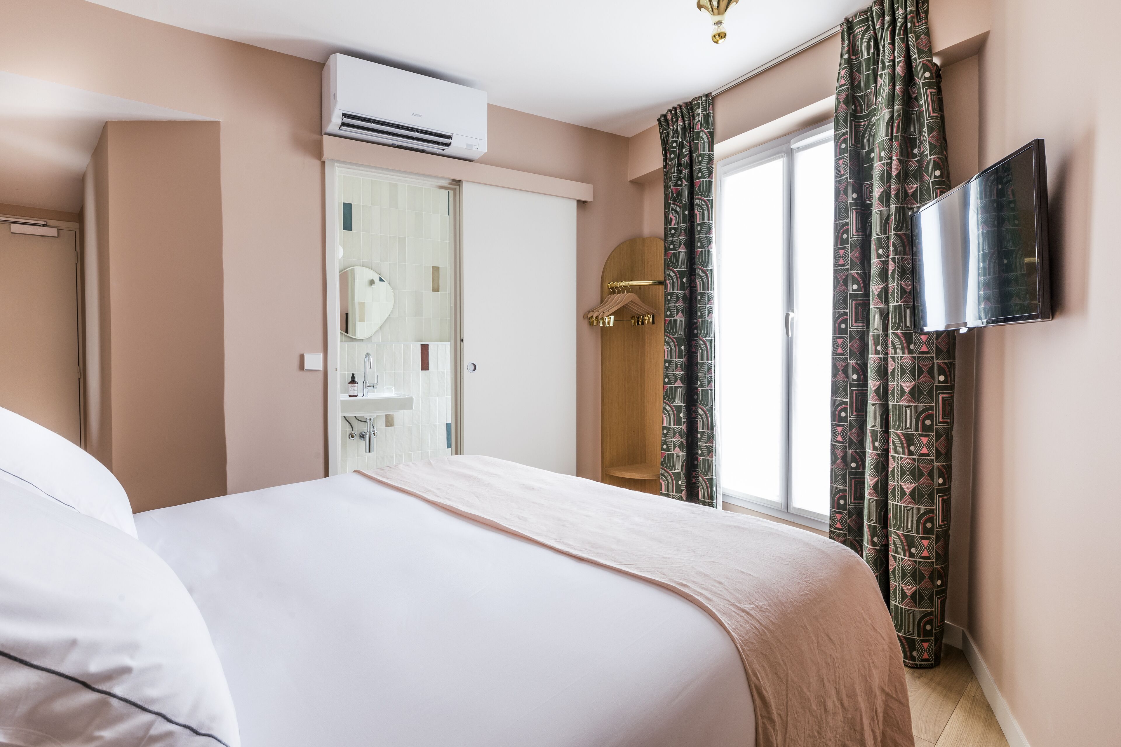 pillow-top beds, desk, laptop workspace, blackout curtains