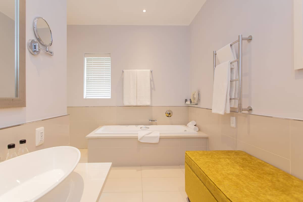 separate bathtub and shower, deep-soaking bathtub, free toiletries