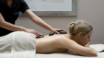 Experience rejuvenating massage therapy on a comfortable massage table.