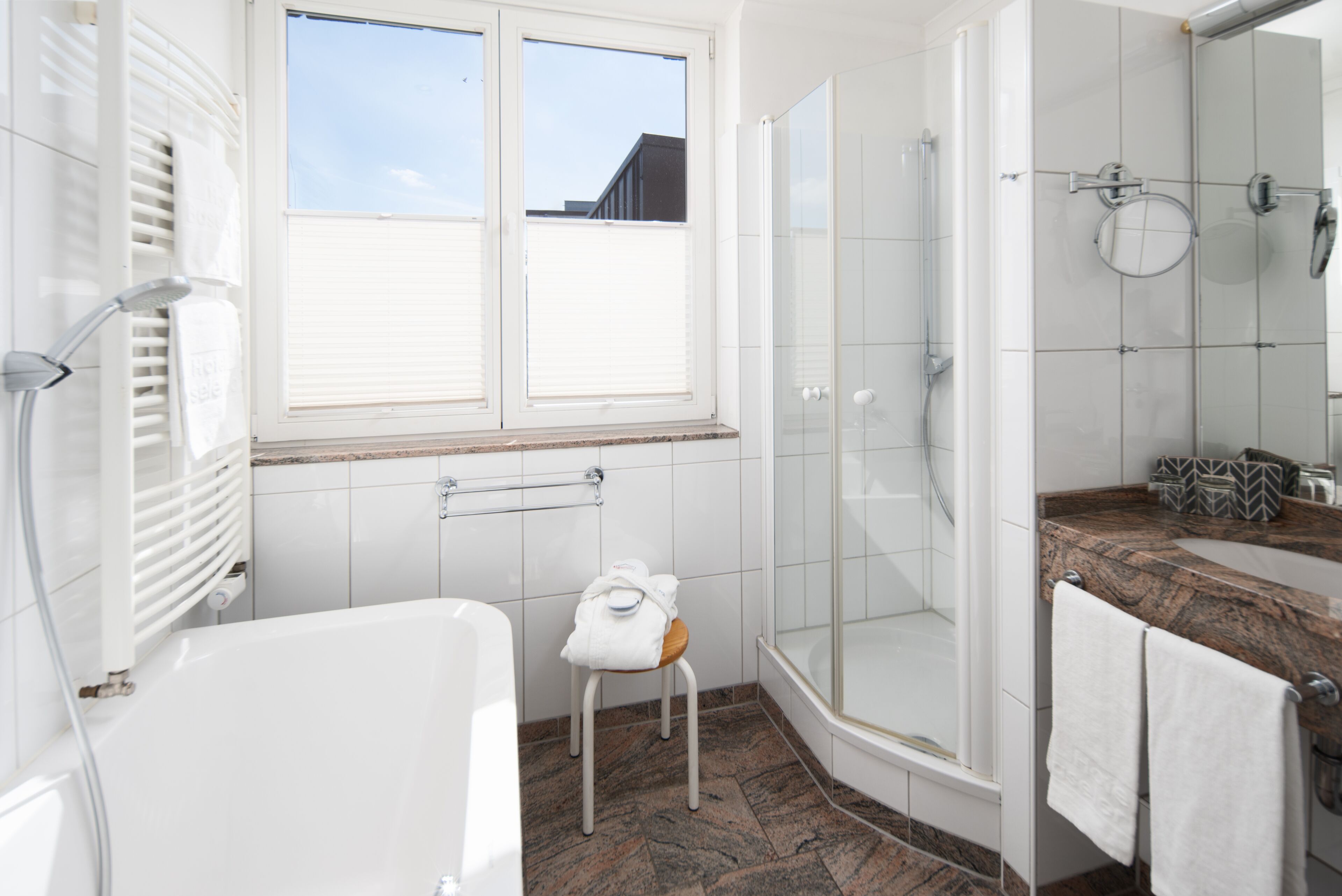 penthouse suite with balcony | bathroom | eco-friendly toiletries, hair dryer, bathrobes, slippers