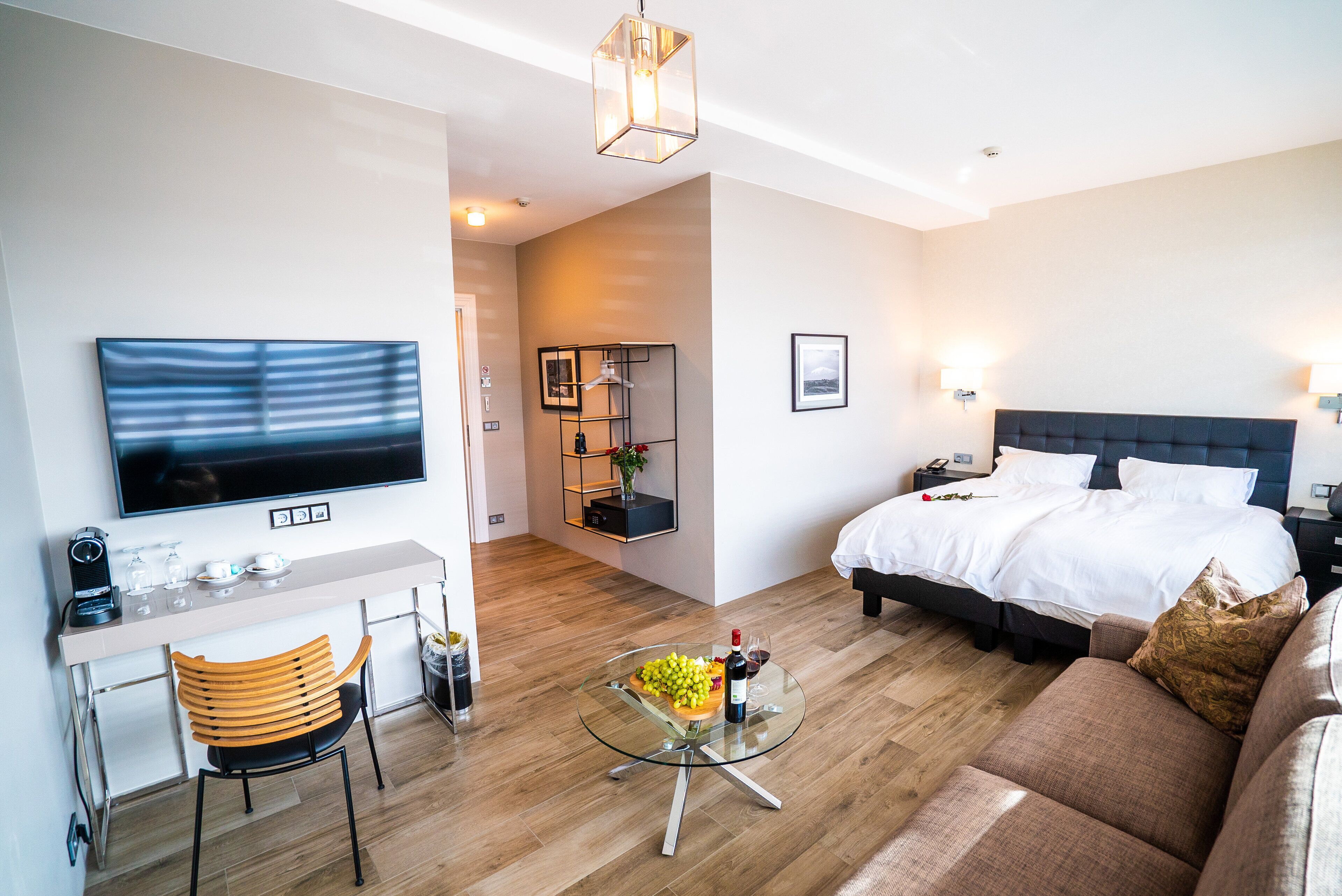 family room | 1 bedroom, premium bedding, minibar, in-room safe