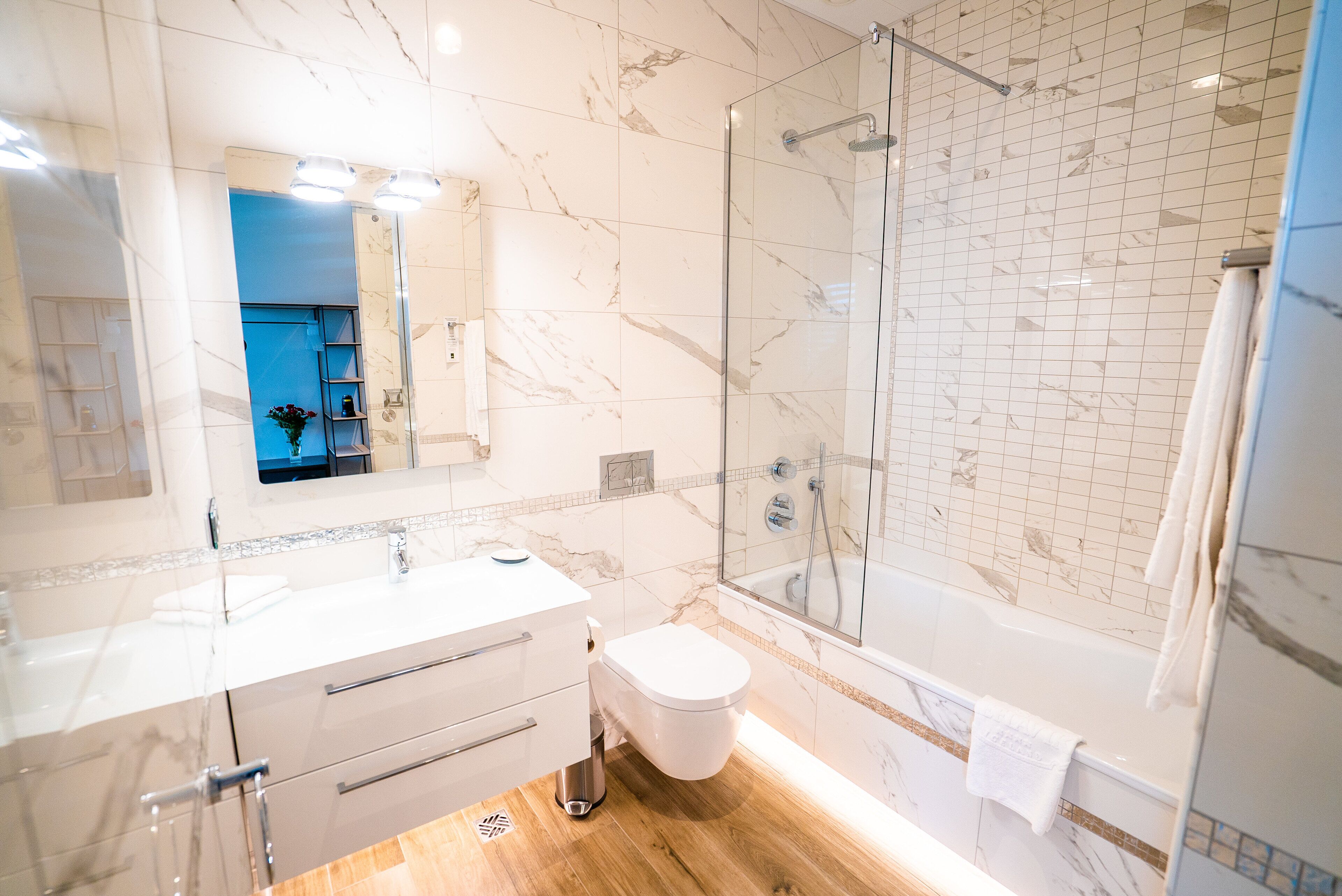 family room | bathroom | shower, designer toiletries, hair dryer, towels