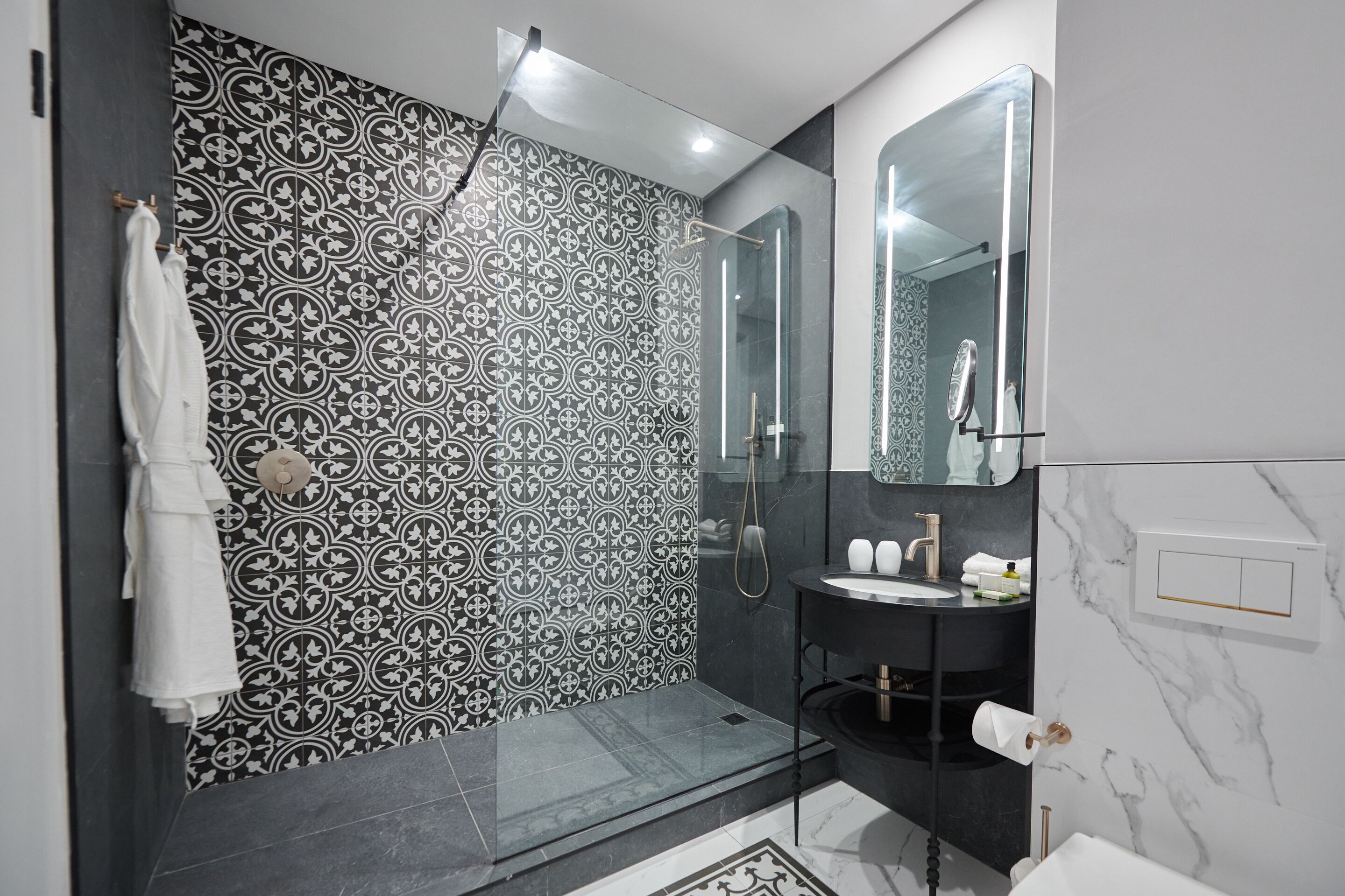 family suite | bathroom | separate bathtub and shower, free toiletries, hair dryer, bathrobes