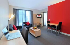 One Bedroom Apartment | Living area | 32-inch LCD TV with digital channels, TV