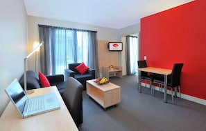 One Bedroom Apartment | Living area | 32-inch LCD TV with digital channels, TV