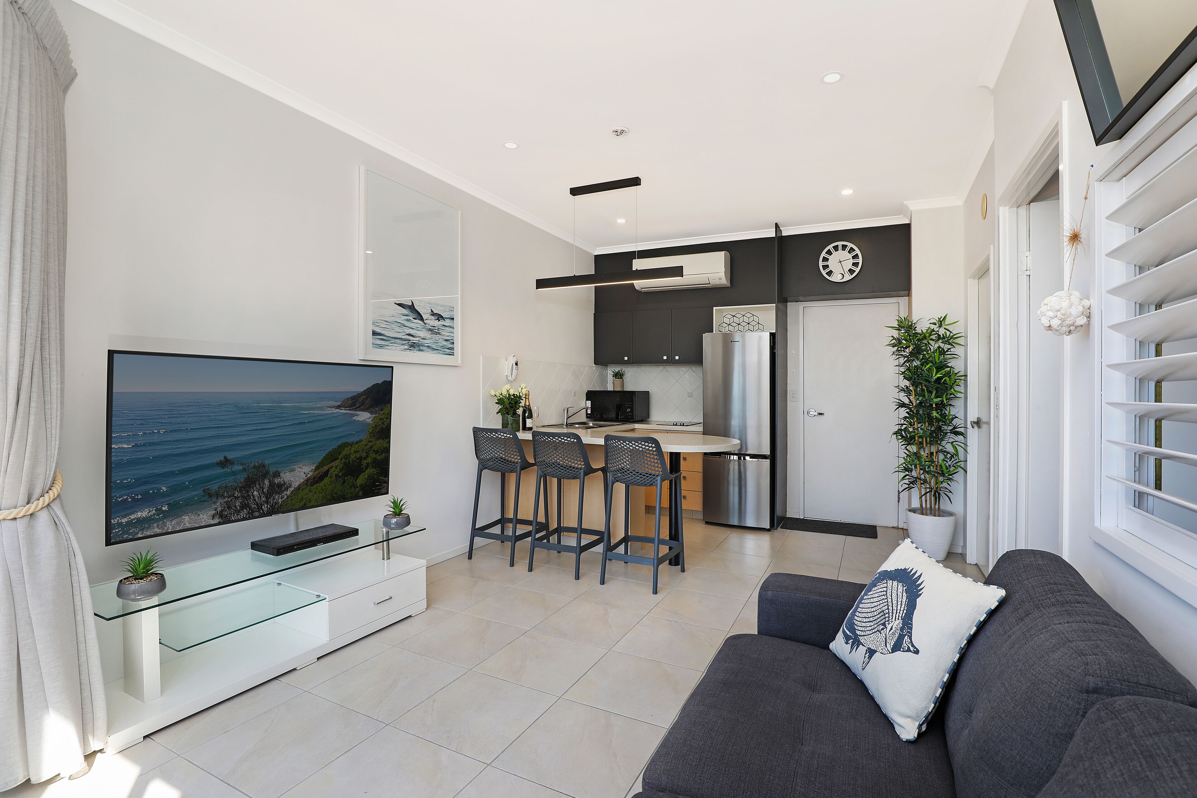 Deluxe One Bedroom Apartment Upper Level | Living area | TV
