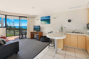 Deluxe One Bedroom Apartment Upper Level | Living area | TV - Ocean Boulevard (Alexandra Headland)