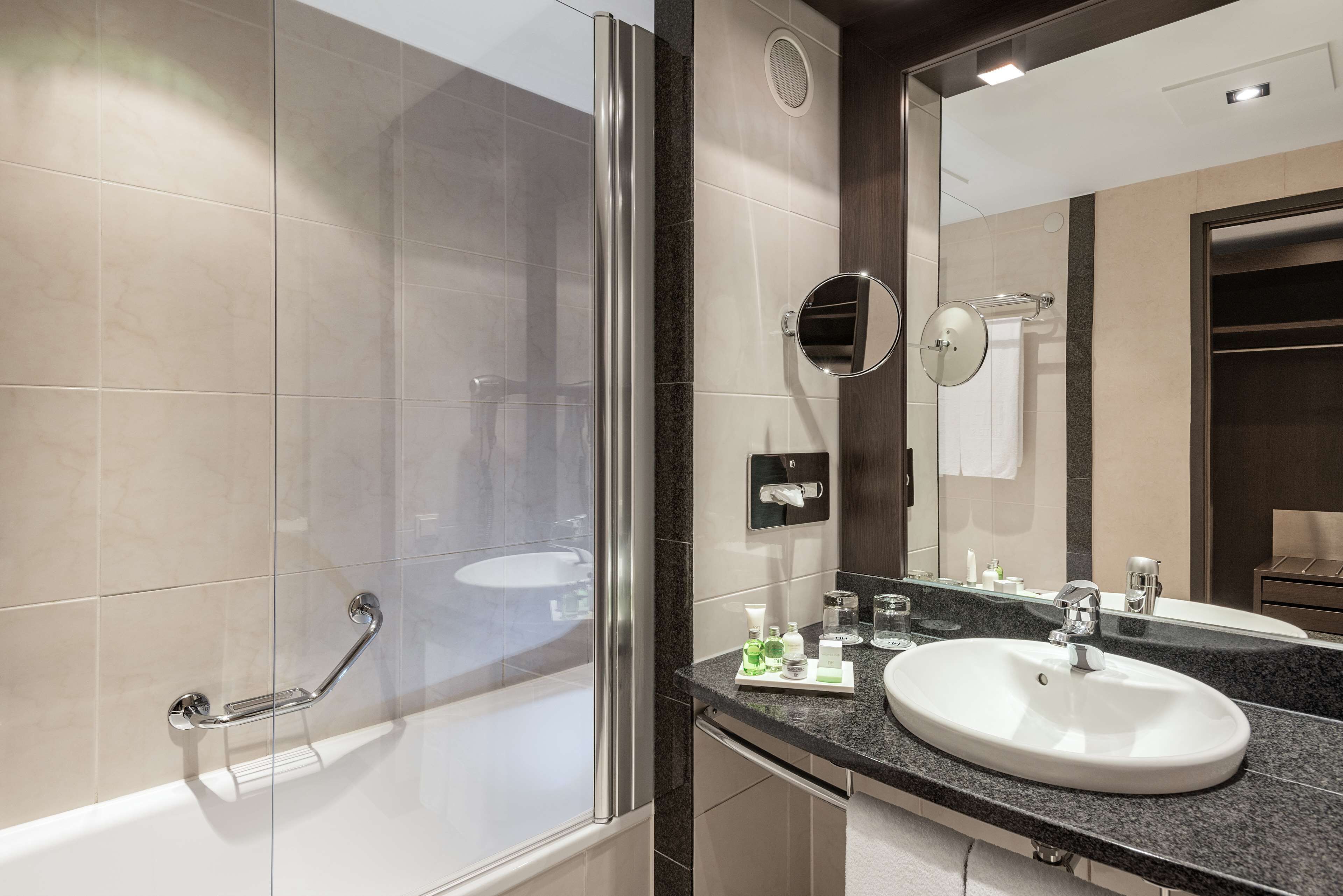 combined shower/bathtub, eco-friendly toiletries, hair dryer, bathrobes