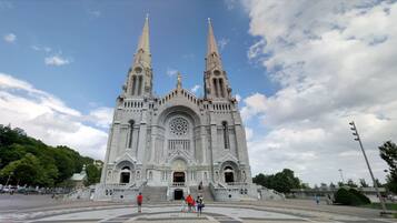 A large cathedral with two tall spires and a central rose window.