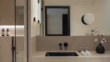 Shower, designer toiletries, hair dryer, bathrobes