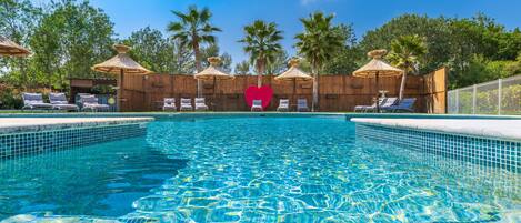 Seasonal outdoor pool, pool umbrellas, pool loungers