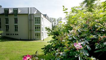 A modern building with a flat roof and large windows.