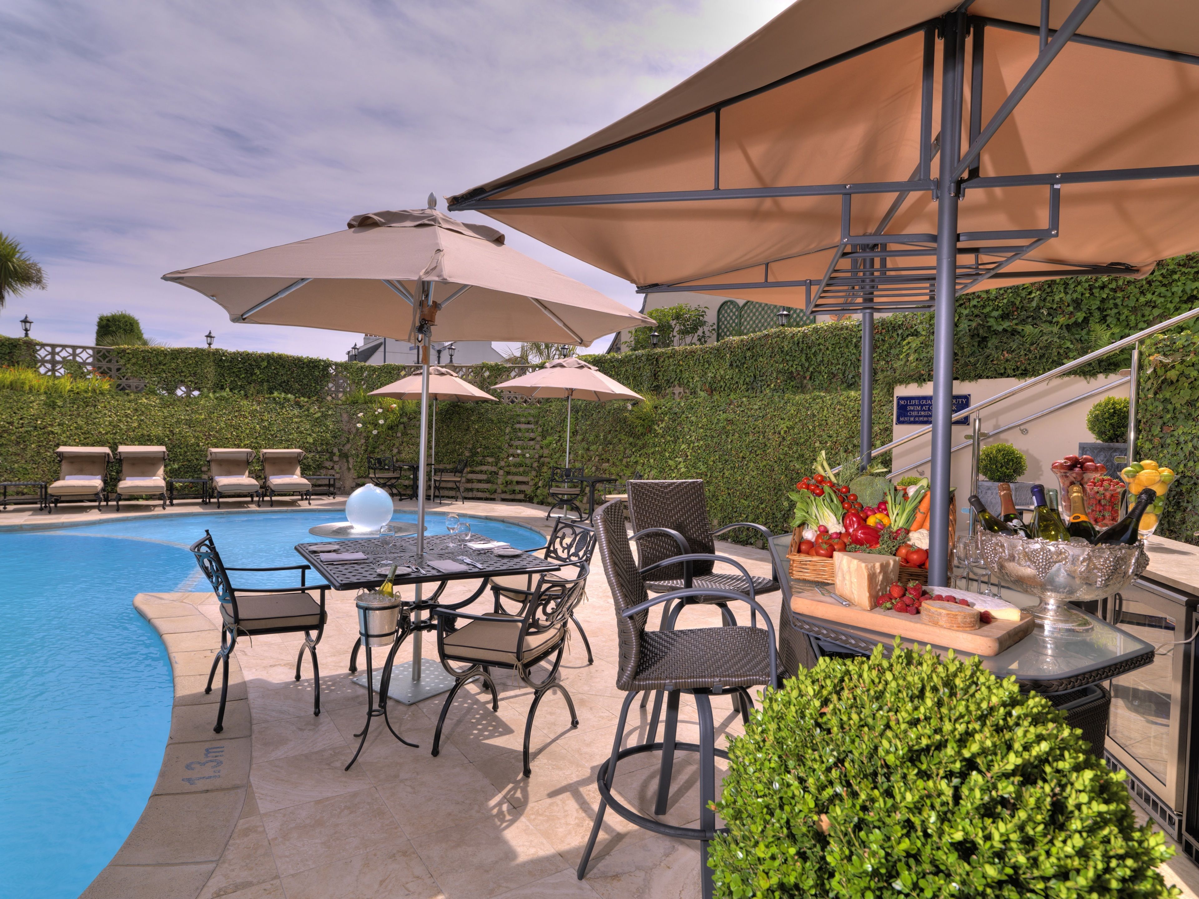 seasonal outdoor pool, pool umbrellas, pool loungers