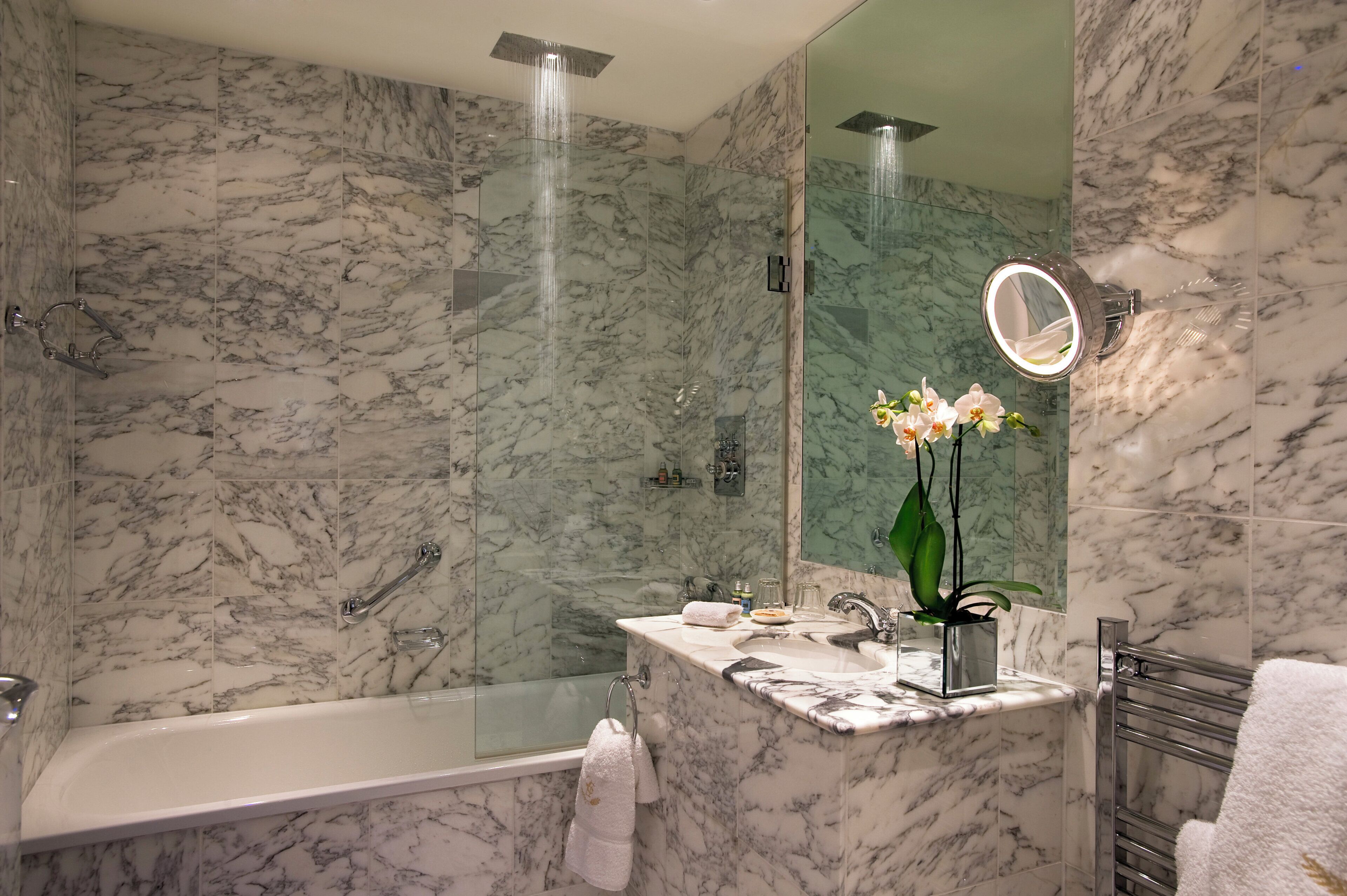 Combined shower/bathtub, designer toiletries, hair dryer, bathrobes