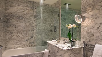 Combined shower/bathtub, designer toiletries, hair dryer, bathrobes