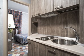 Premium bedding, down comforters, minibar, in-room safe