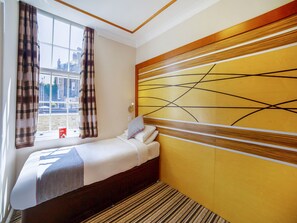 Habitación individual estándar | Caja fuerte, sistema de insonorización, wifi gratis y ropa de cama