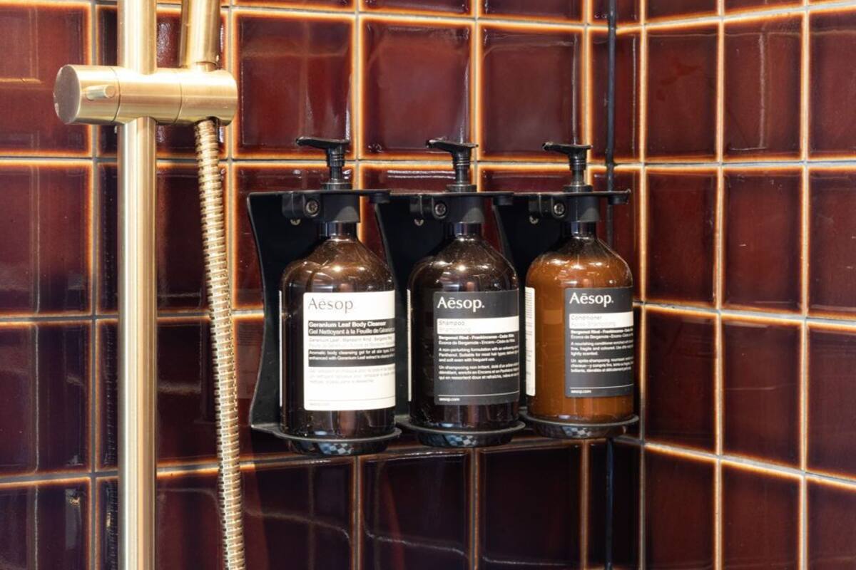 premium king | bathroom | designer toiletries, hair dryer, towels, soap