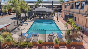 Outdoor pool, open 7 AM to 9 PM, pool loungers