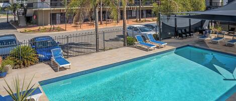 Outdoor pool, open 7 AM to 9 PM, pool loungers