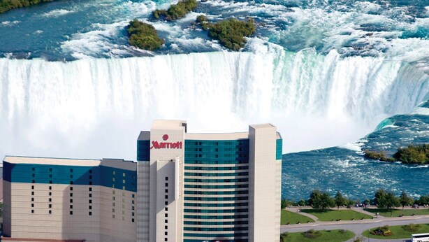 A hotel with a view of a large waterfall. - Marriott Niagara Falls Fallsview Hotel & Spa (Niagara Falls)