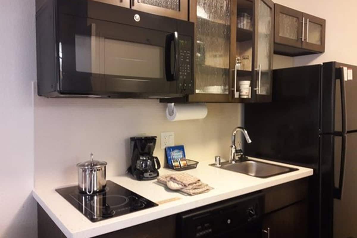 full-sized fridge, microwave, stovetop, dishwasher