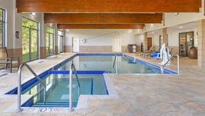 An indoor swimming pool with a wooden ceiling, tiled floor, and a no swimming sign. - Best Western Plus Eau Claire Conference Center (Eau Claire)