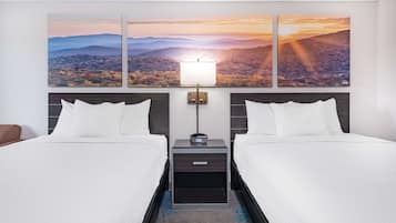 Desk, blackout drapes, iron/ironing board, free cribs/infant beds