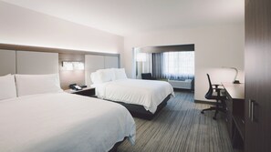 A hotel room with two beds, a desk, a chair, a lamp, and a window with curtains. - Holiday Inn Express Lompoc by IHG (Lompoc)