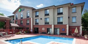 A Holiday Inn Express building with a swimming pool, outdoor seating, and a 'No Diving' sign. - Holiday Inn Express Glenwood Springs by IHG (Glenwood Springs)