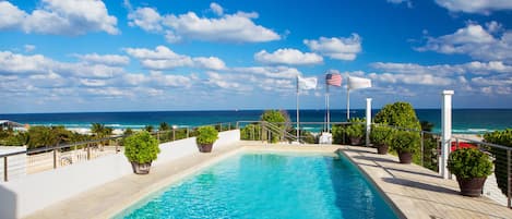 Outdoor pool, open 7:00 AM to 7:00 PM, pool umbrellas, sun loungers