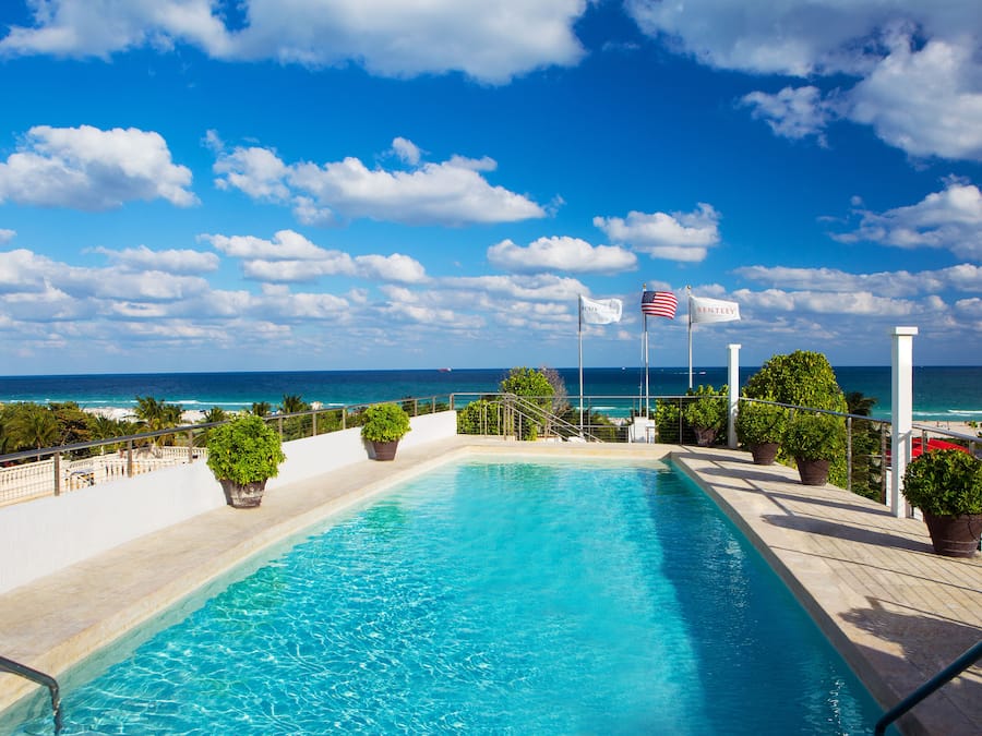 Outdoor pool, open 7:00 AM to 7:00 PM, pool umbrellas, sun loungers