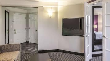 Premium bedding, desk, laptop workspace, blackout curtains