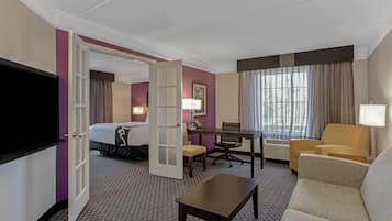 Deluxe Suite, 1 King Bed, Non Smoking | Premium bedding, desk, laptop workspace, blackout drapes