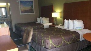 A hotel room with two beds, a desk, a chair, a lamp, and a telephone. - Days Inn by Wyndham Donalsonville (Donalsonville)