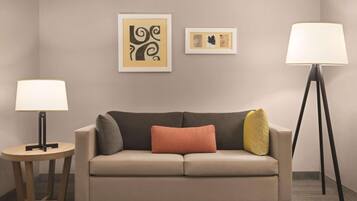 Premium bedding, desk, laptop workspace, blackout drapes