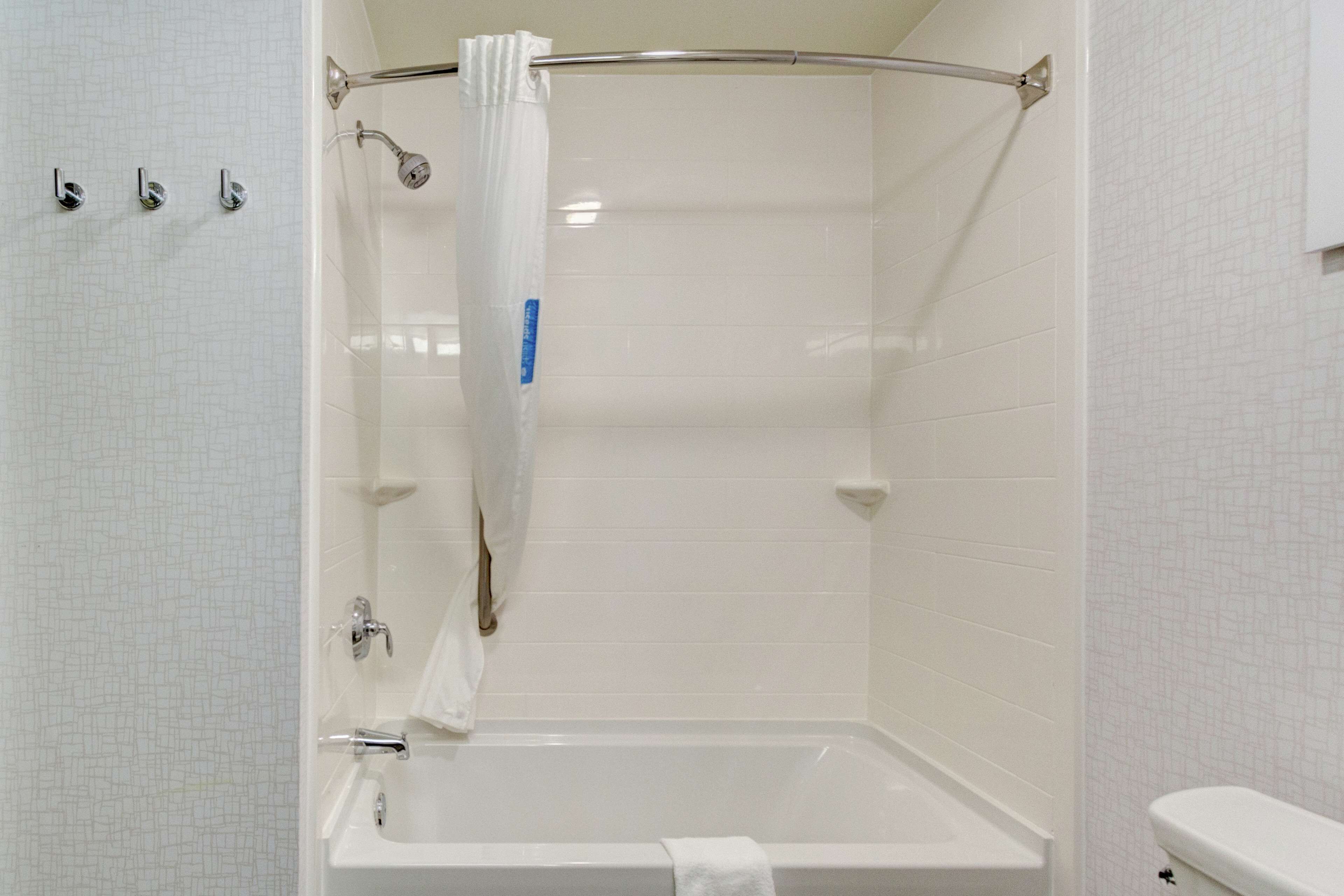 room, 2 queen beds, bathtub | bathroom | hair dryer, towels