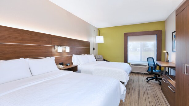 A hotel room with two beds, a desk, a chair, and a large window. - Holiday Inn Express & Suites Three Rivers by IHG (Three Rivers)